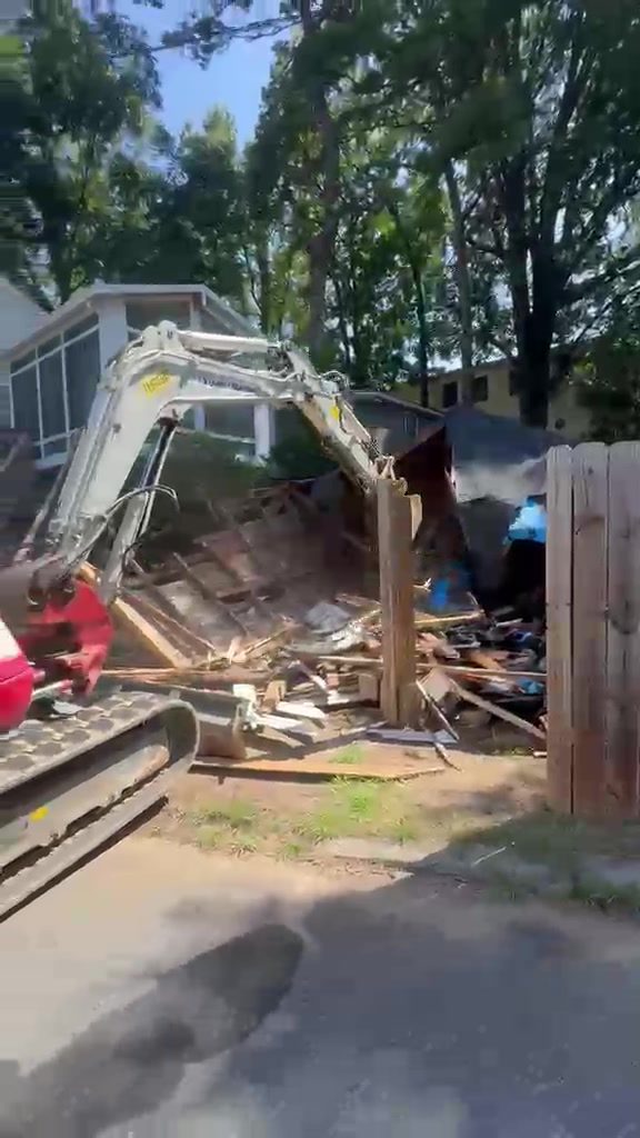 Demolition debris being loaded out after a house and shed teardown in Cornelius NC