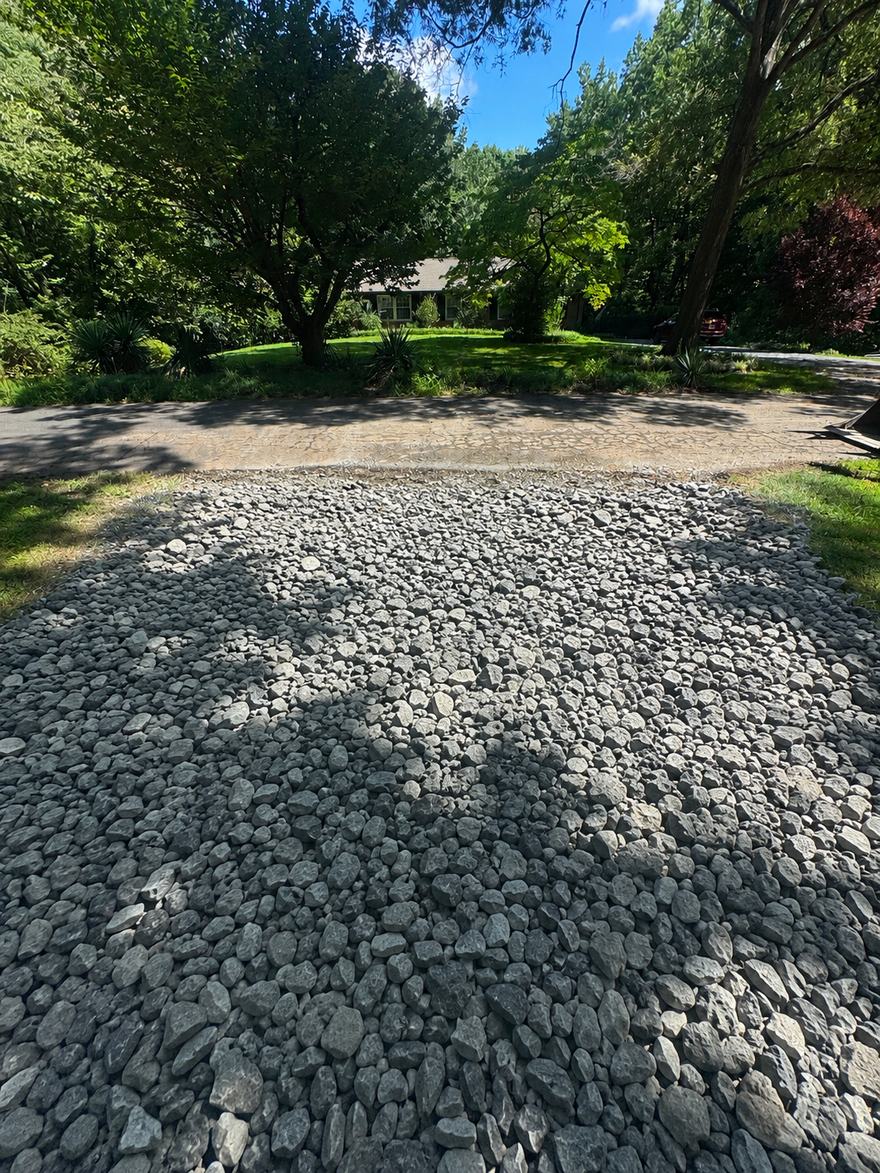Surge rock base laid on the same driveway during installation