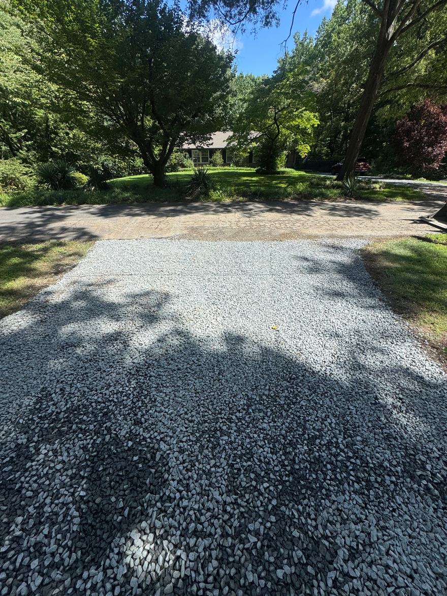 Finished gravel driveway topped with #57 crushed stone
