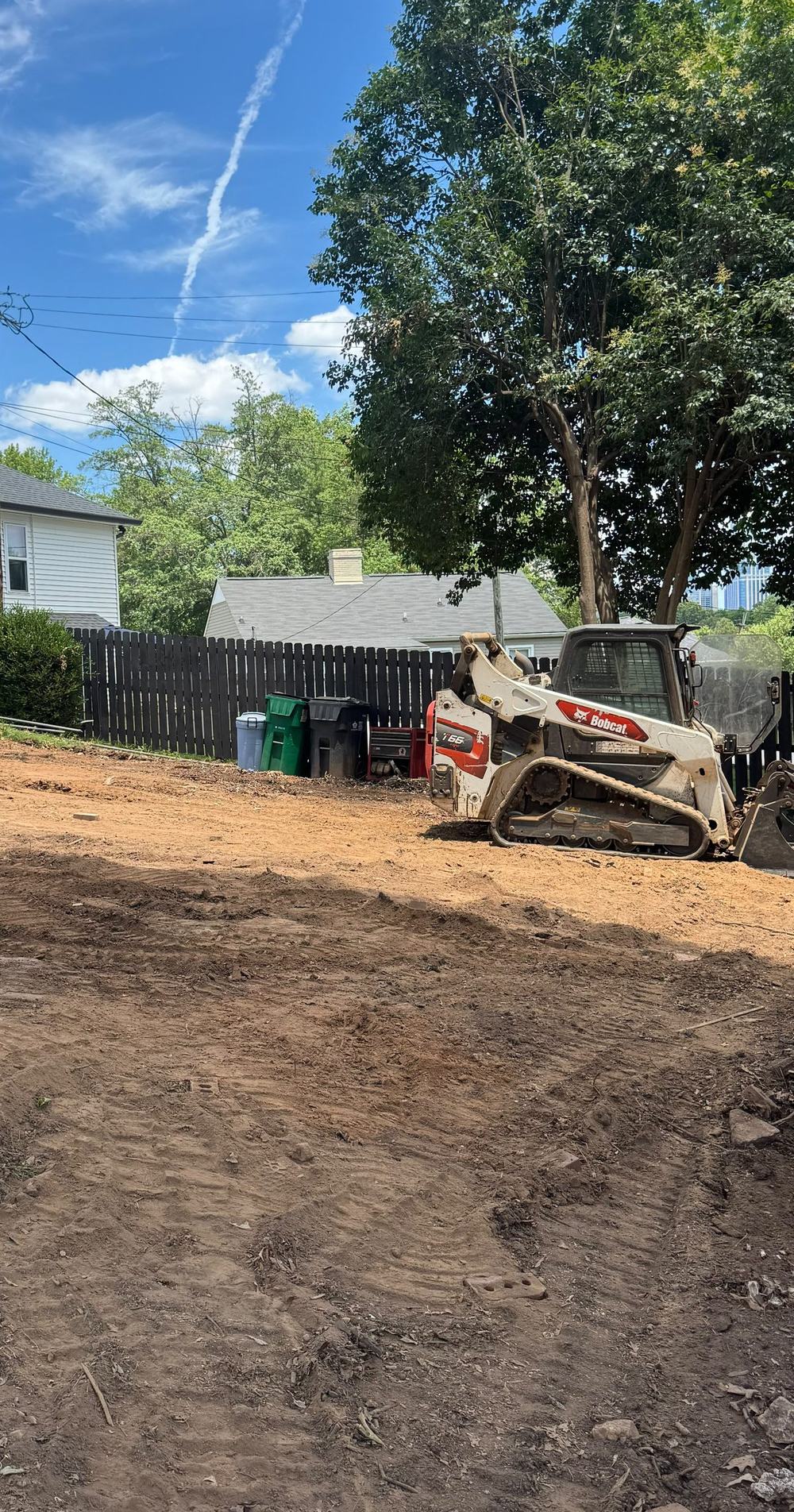 Bobcat track loader on a freshly grubbed residential lot in Huntersville NC